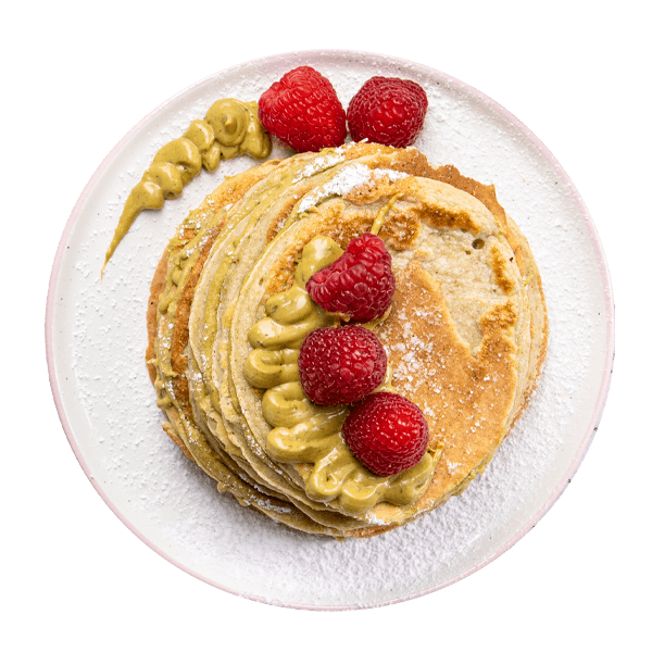 Pancake proteici con crema di pistacchio e lamponi