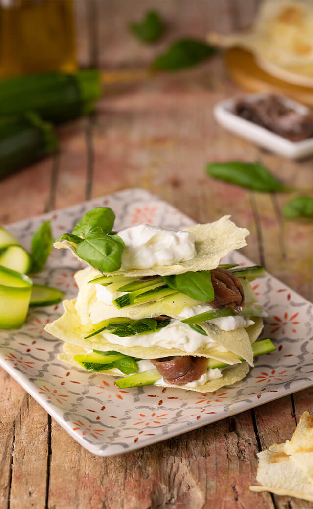 Torretta di pane carasau con burrata, zucchine crude e alici