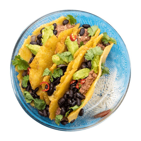 Tacos con carne piccante, fagioli neri e guacamole